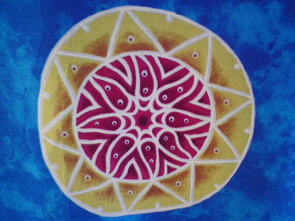 Colorful circular batik pattern on fabric.