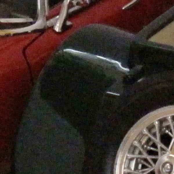 A close-up photo of a car tire and wheel.