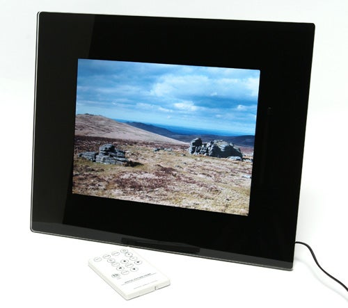 Jessops 10.4-inch digital picture frame displaying landscape photo with remote.