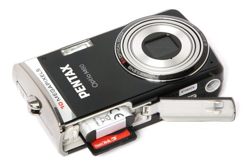 Pentax Optio M60 camera with open battery compartment.