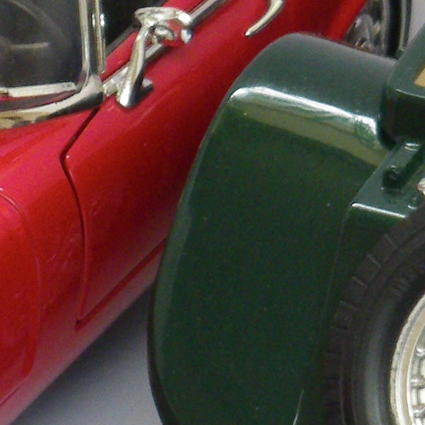 Close-up photo of a red toy car model.