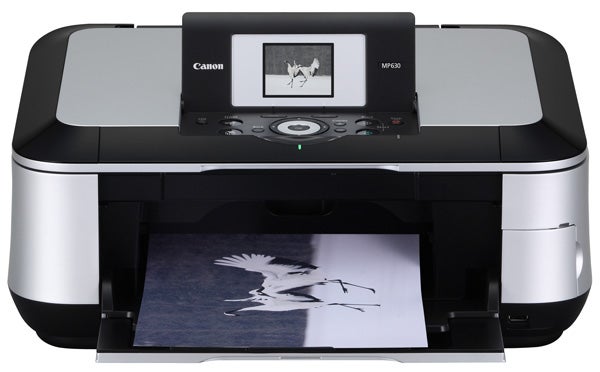 Canon PIXMA MP630 printer with printed photo output.