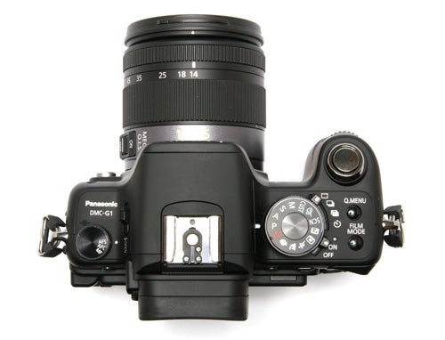 Panasonic Lumix DMC-G1 camera with lens attached from above.