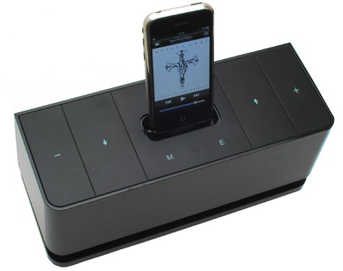 Gear4 Blackbox 24/7 speaker with docked smartphone displaying music app.