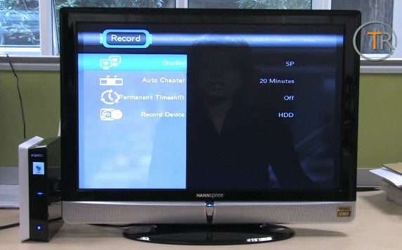Emtec Movie Cube S800 with on-screen menu next to TV.
