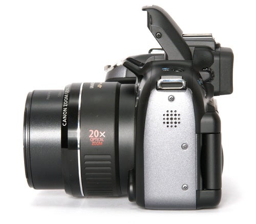 Canon PowerShot SX10 IS digital camera displayed with lens extended.