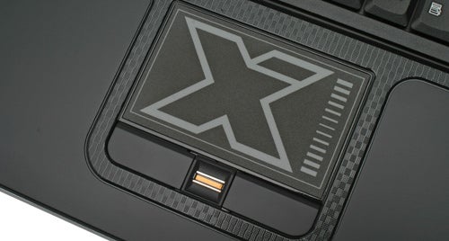 Close-up of Rock Xtreme 780 gaming notebook touchpad and logo.