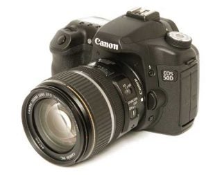 Canon EOS 50D DSLR camera with zoom lens.