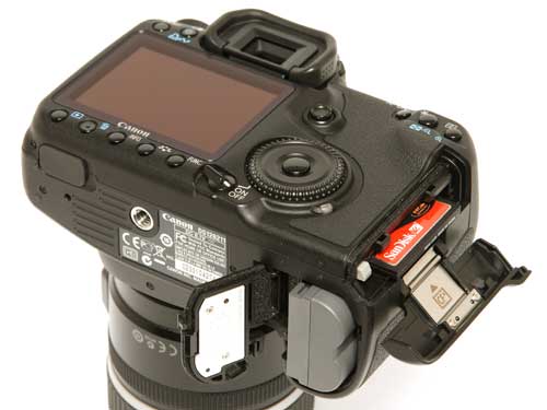 Canon EOS 50D camera with open memory card slot.