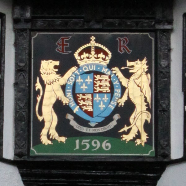 Coat of arms plaque with lions and a date of 1596.