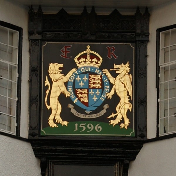 Ornate coat of arms plaque with the date 1596.
