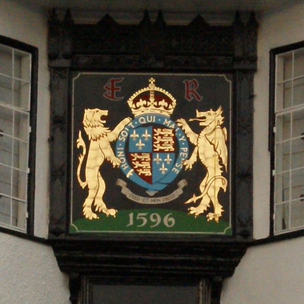 Coat of arms on building facade with date 1596.
