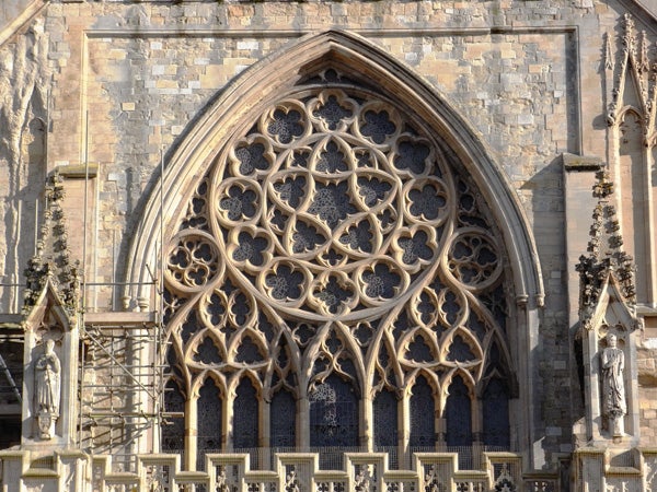 Detailed rose window on gothic cathedral facade