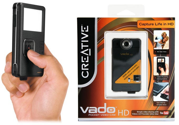 Person holding Creative Vado HD camera with packaging.