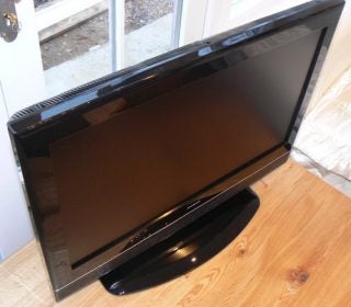 Goodmans LD2667D 26-inch LCD TV on wooden floor.