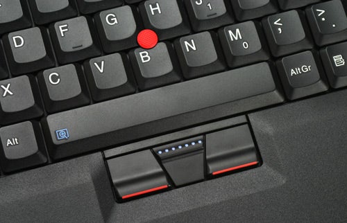 Close-up of Lenovo ThinkPad keyboard with TrackPoint nub.