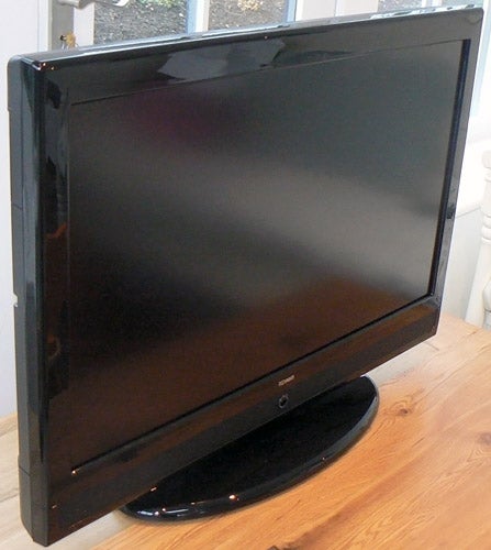 Tesco Technika LCD32-209 32-inch LCD TV on wooden surface.