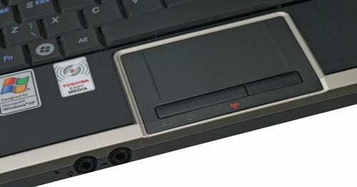 Close-up of Toshiba NB100-128 laptop's touchpad and keyboard.