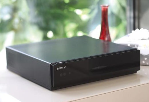Sony Bravia TV set-top box on white surface.