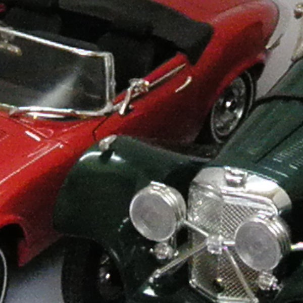Close-up of vintage toy cars in a collection