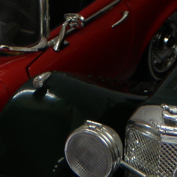 Close-up of vintage red and silver model cars