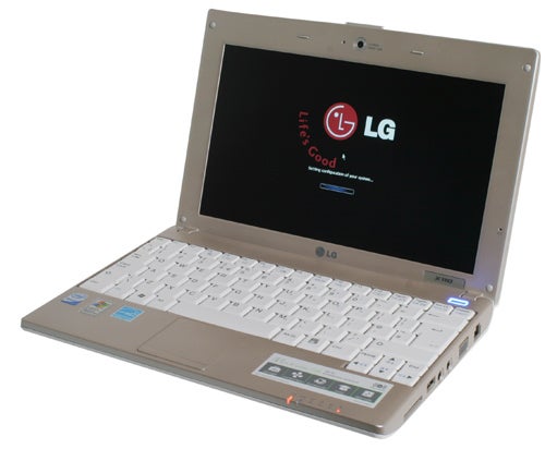 LG X110 Netbook with logo on screen, white keyboard, angled view.