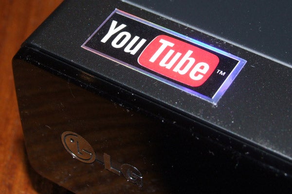 Close-up of LG Blu-ray player with YouTube sticker.