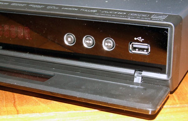 Close-up of LG BD370 Blu-ray player's front panel and tray.