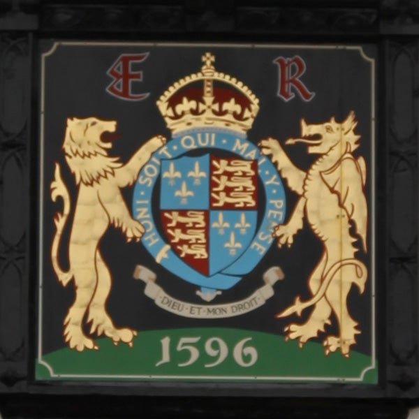 image of a coat of arms with lions and a crown.