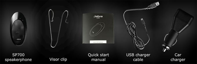 Jabra SP700 speakerphone and accessories on dark background.