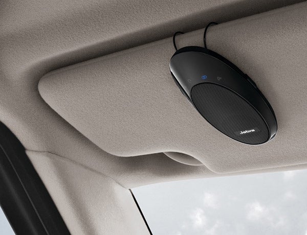 Jabra SP700 Bluetooth Speakerphone attached to car ceiling.