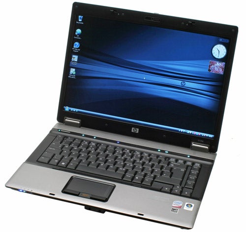 HP Compaq 6730b laptop open and powered on.