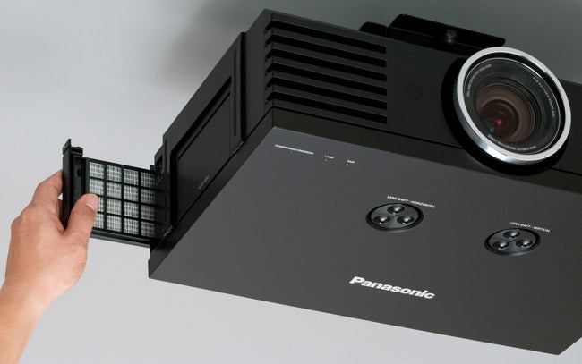 Panasonic PT-AE3000 projector with hand replacing filter.