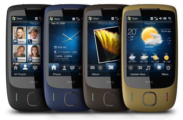 Four HTC Touch 3G smartphones showing different applications.