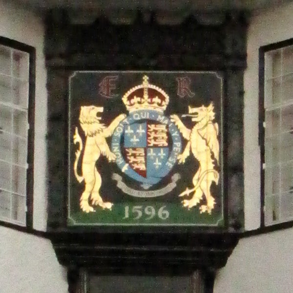 Coat of arms with lions and date 1596 on plaque.