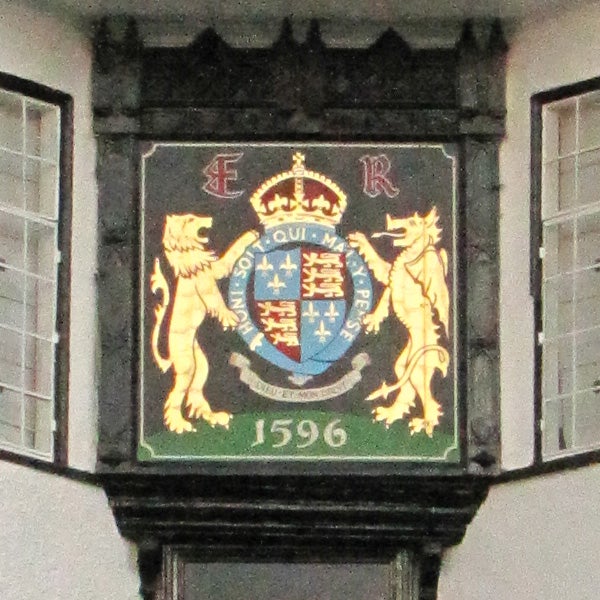 Coat of arms on a wall with the date 1596