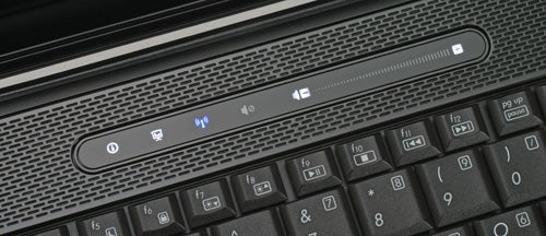 Close-up of HP Compaq 2230s laptop keyboard and media buttons.