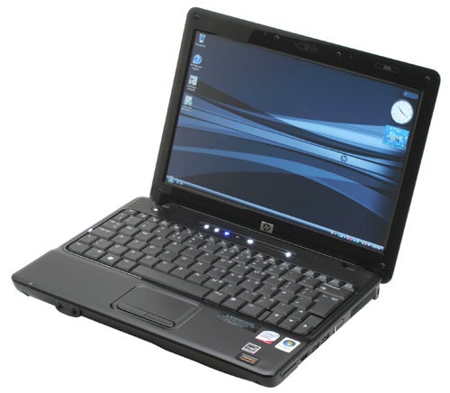 HP Compaq 2230s notebook open and powered on.