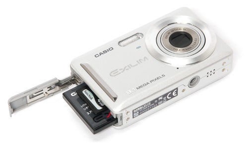 Casio Exilim EX-Z19 camera with open battery compartment.
