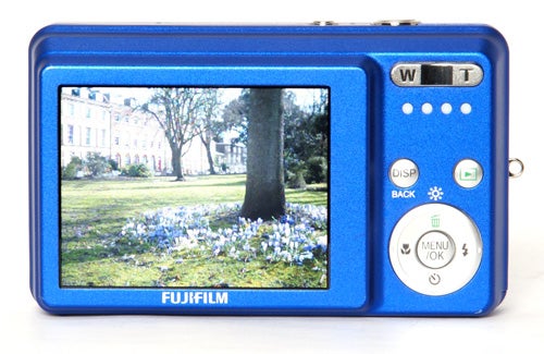 Blue Fujifilm FinePix J12 camera displaying a photo on screen.