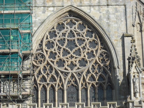 Detailed stonework of a Gothic cathedral facade.