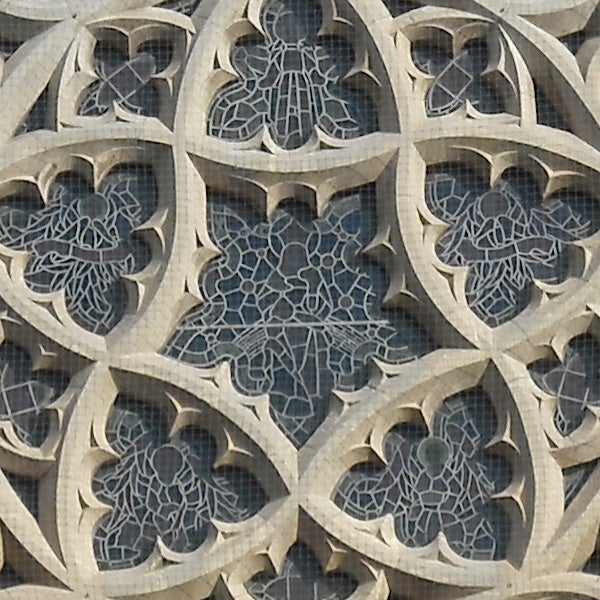 Detailed stonework of gothic window tracery.
