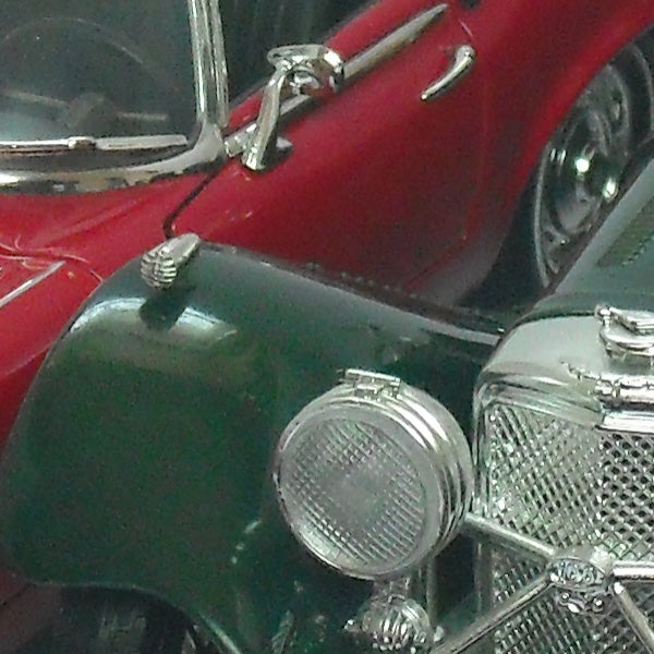Close-up photo of vintage toy cars.