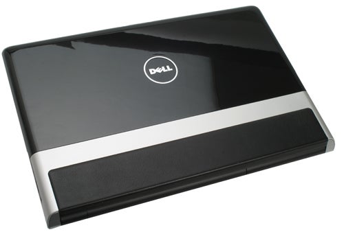Dell Studio XPS 16 laptop with glossy black lid and silver trim.