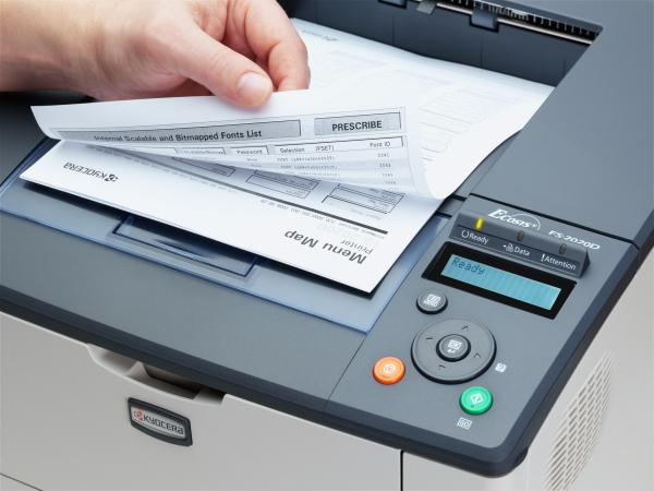 Kyocera Mita FS-2020D Laser Printer with printed documents.