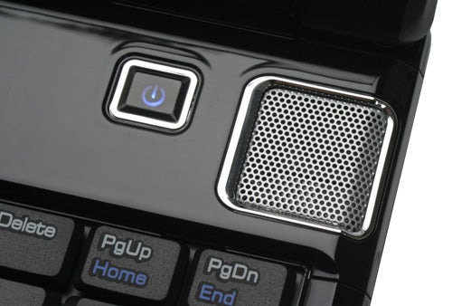 Close-up of MSI EX620 notebook power button and speakers.