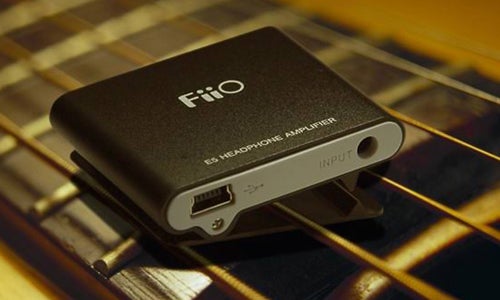 FiiO E5 Headphone Amplifier on wooden surface.