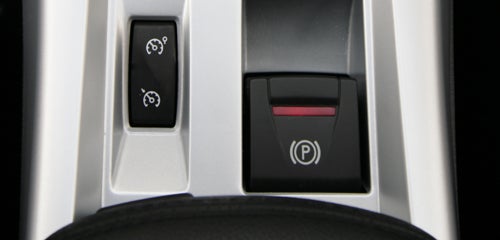 Close-up of Renault Laguna Coupe parking brake button.