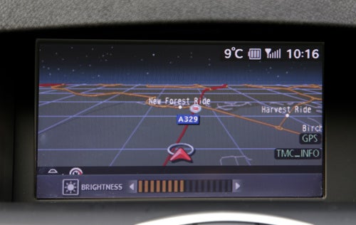 Renault Laguna Coupe's navigation system display showing route and temperature.