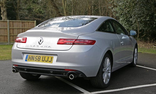 Rear view of a silver Renault Laguna Coupe GT on a driveway